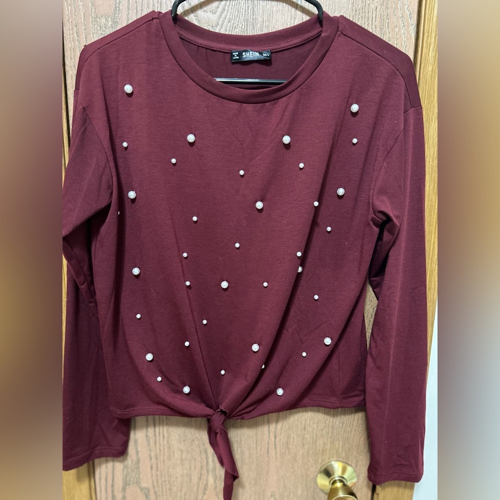 Woman’s long sleeved blouse
